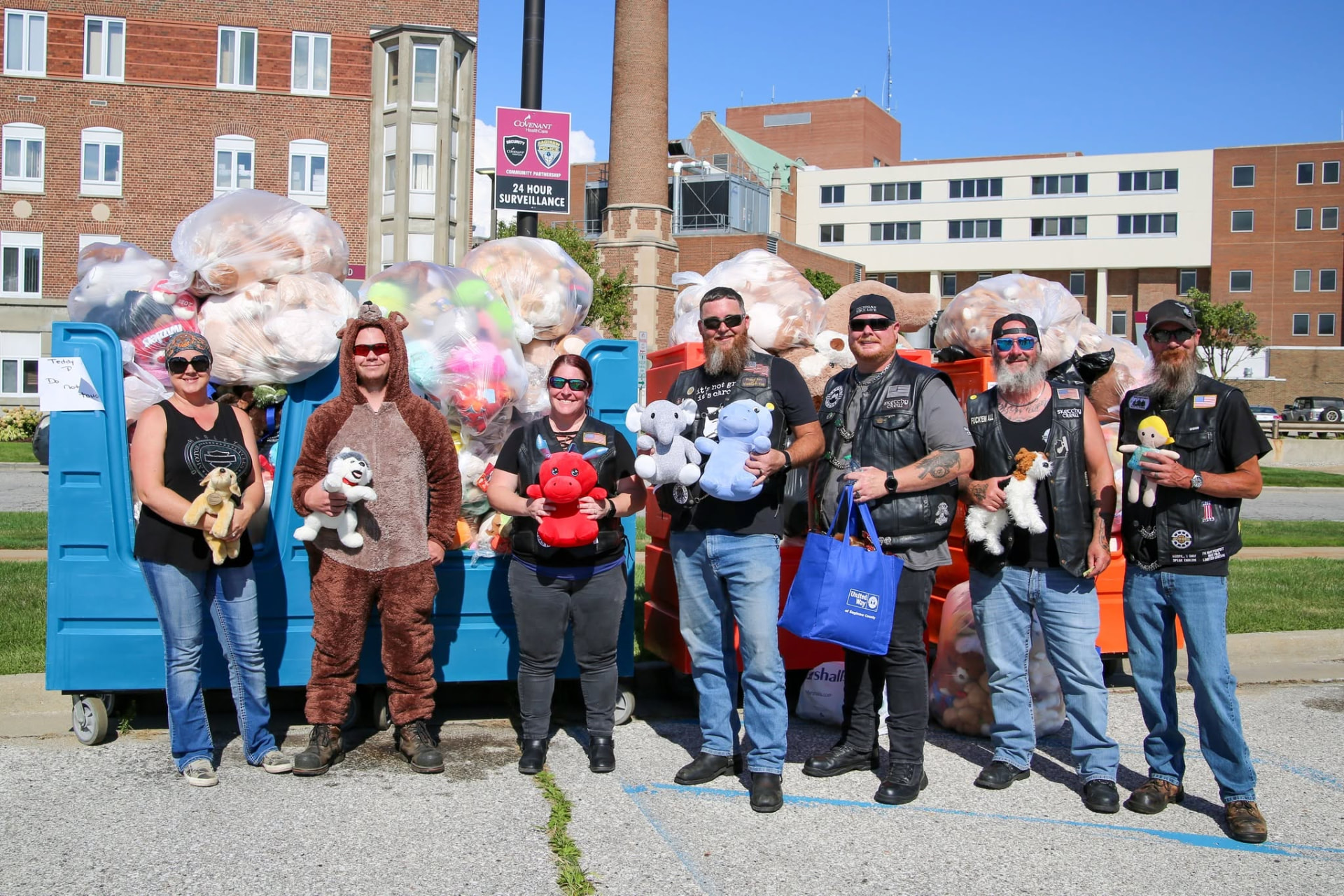 Chapter members and volunteers gathered with stuffed animals and donation bins for the Teddy Bear Run
