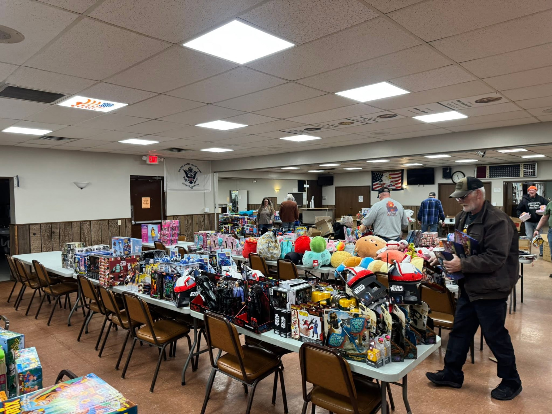 Tables full of toys and gifts for children inside the American Legion hall during the annual Toyz For Kidz collection