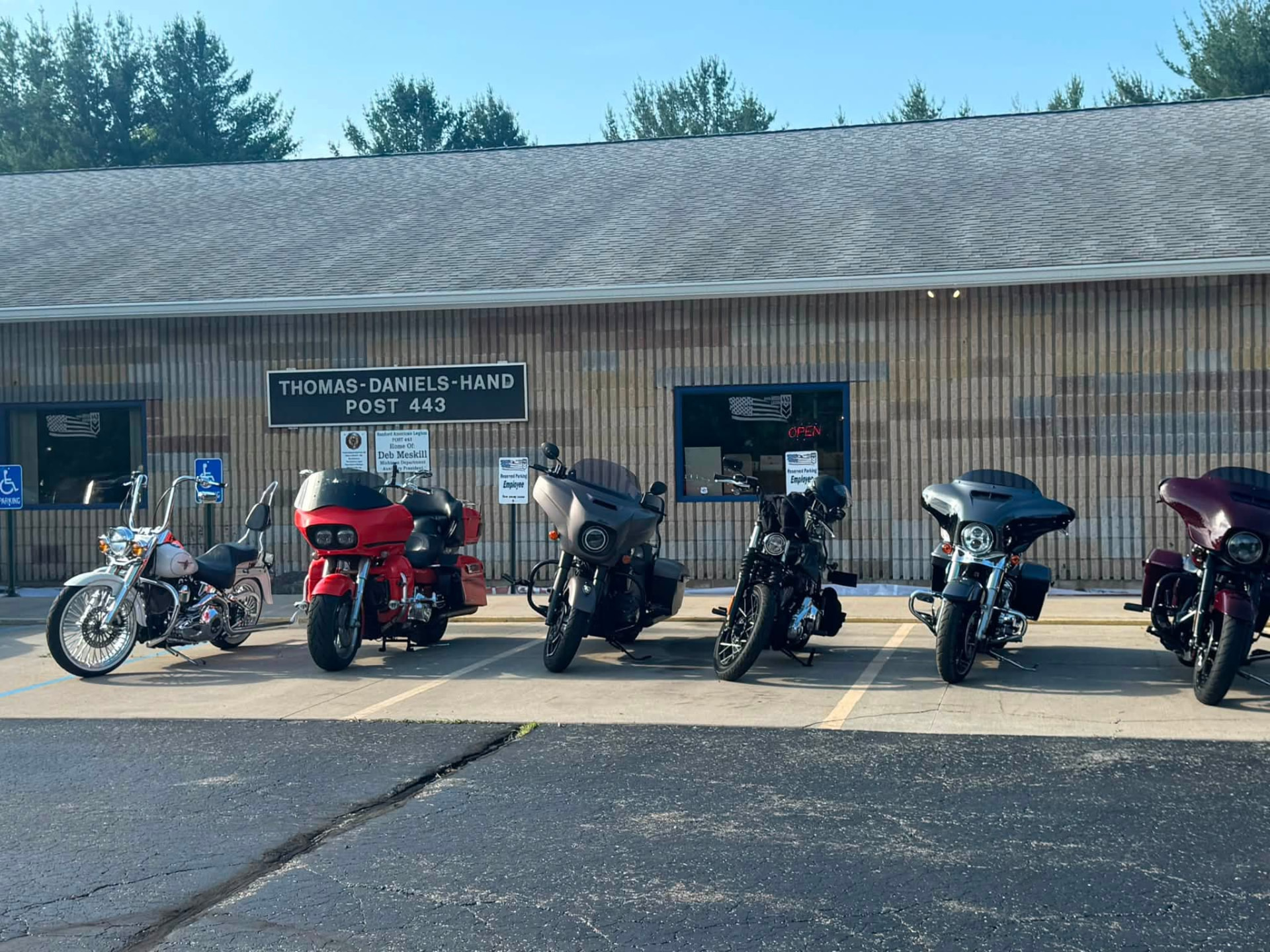 Motorcycles lined up in front of Thomas-Daniels-Hand Post 443 during a chapter event