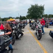 Motorcycles lined up at the Teddy Bear Run, ready to ride for a cause